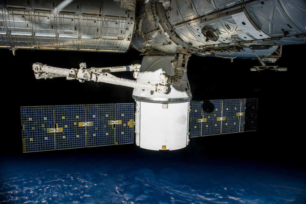 Photo of a satellite docked at the ISS